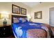 Comfortable bedroom features a queen-size bed with decorative pillows and stylish wall decor at 4126 Breakview Dr # 40901, Orlando, FL 32819