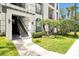 Inviting building entrance with well-manicured landscaping and an outdoor staircase at 4126 Breakview Dr # 40901, Orlando, FL 32819