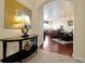 Inviting entryway featuring a stylish table, mirror, and view into the living and dining areas at 4126 Breakview Dr # 40901, Orlando, FL 32819