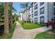 Beautiful condo exterior with lush landscaping and convenient walkway at 4126 Breakview Dr # 40901, Orlando, FL 32819