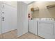 Practical laundry room with washer, dryer, and shelving for organized storage and convenience at 4126 Breakview Dr # 40901, Orlando, FL 32819