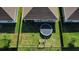 Aerial view showcases a well-maintained backyard with green spaces, play areas, and neighborly surroundings at 424 Lazio Cir, Debary, FL 32713