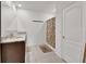 Well-lit bathroom featuring a double vanity, granite countertop, and a shower with a floral curtain at 424 Lazio Cir, Debary, FL 32713