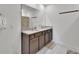 Well-maintained bathroom with double sinks, granite countertops, and neutral-toned decor at 424 Lazio Cir, Debary, FL 32713