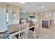 Spacious dining room with views of the open-concept living area and stylish decor at 424 Lazio Cir, Debary, FL 32713