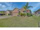 Charming single-story home with well-manicured lawn and mature landscaping at 424 Lazio Cir, Debary, FL 32713