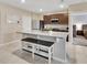 Bright kitchen featuring granite countertops, a spacious island, and stainless steel appliances at 424 Lazio Cir, Debary, FL 32713