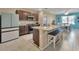 Bright kitchen featuring granite countertops, a spacious island, and stainless steel appliances at 424 Lazio Cir, Debary, FL 32713