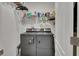 Laundry area with modern washer and dryer, ample shelving, and a clean functional space at 424 Lazio Cir, Debary, FL 32713