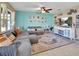 Comfortable living room with a large sectional sofa, stylish rug, and plenty of natural light at 424 Lazio Cir, Debary, FL 32713
