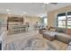 Open concept living space featuring a kitchen, dining area, and a comfortable living room at 424 Lazio Cir, Debary, FL 32713