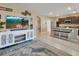 Open concept living space featuring a kitchen, dining area, and a comfortable living room at 424 Lazio Cir, Debary, FL 32713