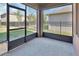 Enclosed patio space featuring a screened-in area with backyard views, enhancing the indoor-outdoor living experience at 424 Lazio Cir, Debary, FL 32713