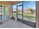 Enclosed patio space with views of the backyard, offering a seamless transition to outdoor play areas and green spaces at 424 Lazio Cir, Debary, FL 32713