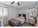 Bedroom featuring neutral colors, a ceiling fan and wood-look floors at 4274 Tatum St, Orlando, FL 32811