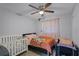 Bright bedroom with a ceiling fan and wood-look floors at 4274 Tatum St, Orlando, FL 32811