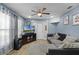 Cozy living room features a ceiling fan, wood-look floors and neutral paint at 4274 Tatum St, Orlando, FL 32811