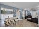 Open-concept living and dining area with wood-look floors at 4274 Tatum St, Orlando, FL 32811