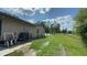 Lush backyard features a lawn and mature trees, providing a private outdoor space at 434 Diamond Acres Rd, Davenport, FL 33837