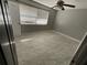 A well-lit bedroom featuring tile floors and a ceiling fan at 434 Diamond Acres Rd, Davenport, FL 33837