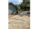 Side view of the home with driveway and landscaping at 434 Diamond Acres Rd, Davenport, FL 33837