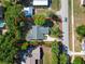 An aerial view shows the home with mature trees surrounding the property at 510 N Leavitt Ave, Orange City, FL 32763
