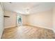 This bright bedroom offers a ceiling fan and wood look flooring at 510 N Leavitt Ave, Orange City, FL 32763