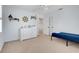 Bright, carpeted bedroom showcases coastal themed decor, including boat and wheel wall hangings at 5224 Saint Regis Pl, Belle Isle, FL 32812