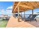 A covered boat dock with boat lift offers convenience and protection for watercraft at 5224 Saint Regis Pl, Belle Isle, FL 32812