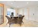 The breakfast nook features a glass-top table, seating for four, and access to the side yard at 5224 Saint Regis Pl, Belle Isle, FL 32812