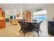 The dining nook is open to the kitchen and features water views, a dining table, and four chairs at 5224 Saint Regis Pl, Belle Isle, FL 32812