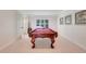 Game room with a pool table and natural light, offering a recreational space for entertainment and relaxation at 5224 Saint Regis Pl, Belle Isle, FL 32812