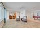 Open-concept living space with tile flooring, water views, and seamless access to the kitchen and other living areas at 5224 Saint Regis Pl, Belle Isle, FL 32812