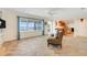 Bright living room with waterfront views, tile floors, and an open layout, perfect for relaxing and entertaining at 5224 Saint Regis Pl, Belle Isle, FL 32812