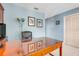 Light-filled office with a large desk, comfortable chair, and stylish decor at 5224 Saint Regis Pl, Belle Isle, FL 32812