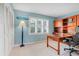 Bright office with natural light, built-in shelving, and a spacious desk for productive work at 5224 Saint Regis Pl, Belle Isle, FL 32812