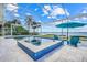 A gorgeous pool and hot tub are situated at the waterfront of this stunning home at 5224 Saint Regis Pl, Belle Isle, FL 32812