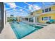 A beautiful screened-in pool area with spa and deck chairs offers the perfect outdoor retreat at 5224 Saint Regis Pl, Belle Isle, FL 32812