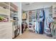 Spacious walk-in closet with built-in shelving and ample storage for clothes and accessories at 5224 Saint Regis Pl, Belle Isle, FL 32812
