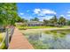 Enjoy the tranquil beauty of this waterfront property, featuring a sandy beach and private dock at 5224 Saint Regis Pl, Belle Isle, FL 32812