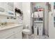 Bathroom featuring a vanity with sink, toilet, and plenty of storage space at 525 E Foothill Way, Casselberry, FL 32707