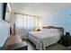 Bedroom featuring hardwood floors and a large bed at 525 E Foothill Way, Casselberry, FL 32707