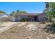 Charming single-story home with a minimalist landscape under a clear blue sky at 525 E Foothill Way, Casselberry, FL 32707