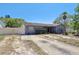 Charming single-story home with a minimalist landscape at 525 E Foothill Way, Casselberry, FL 32707