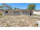 View of the backyard showcases the home's potential for landscaping and outdoor activities at 525 E Foothill Way, Casselberry, FL 32707