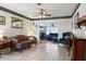 Bright living room showcasing tile flooring and seamlessly connected to the adjacent room at 525 E Foothill Way, Casselberry, FL 32707