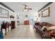 Comfortable living room area with tile floors connecting to the dining area at 525 E Foothill Way, Casselberry, FL 32707