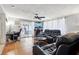 Relaxing living room area with a desk, seating, sliding glass doors, and tile flooring at 525 E Foothill Way, Casselberry, FL 32707