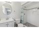 Updated bathroom with a vanity, toilet, and a beautifully tiled walk-in shower at 525 Legume Dr, Port Orange, FL 32127