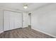 Neat bedroom featuring vinyl floors, neutral walls, a closet and natural light at 525 Legume Dr, Port Orange, FL 32127